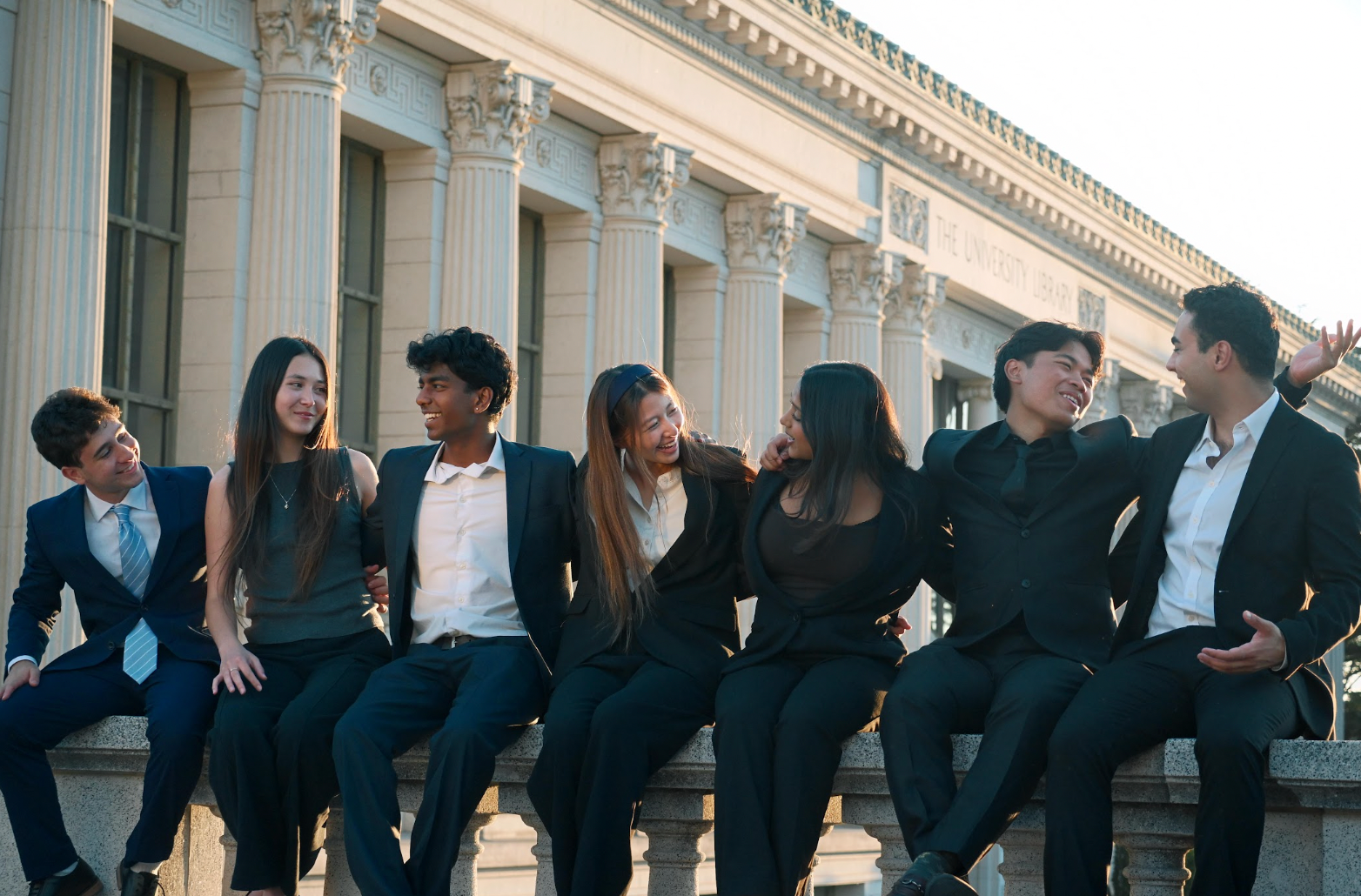 BSB members sitting together outside a UC Berkeley building